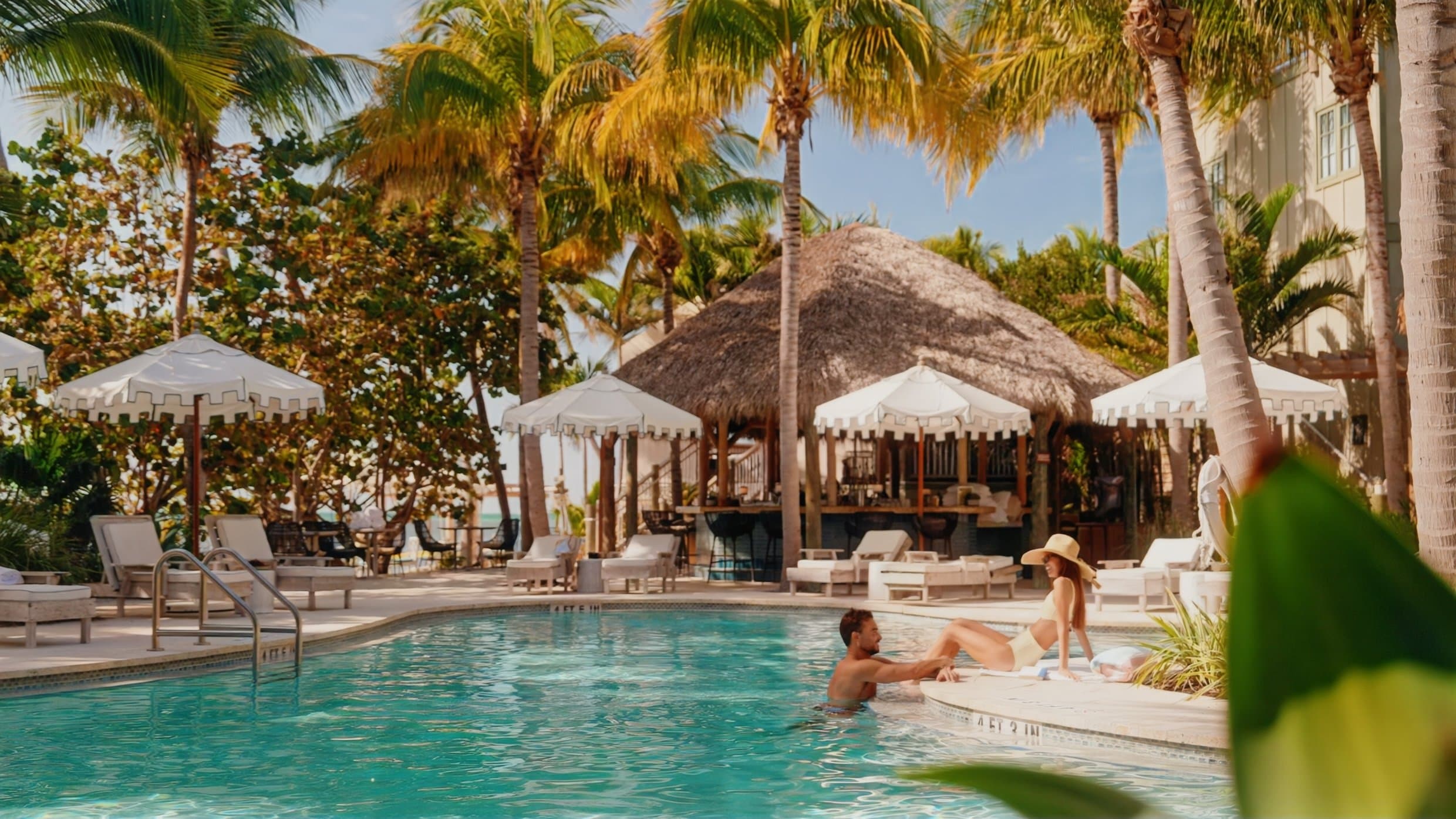 couple relaxing by the pool