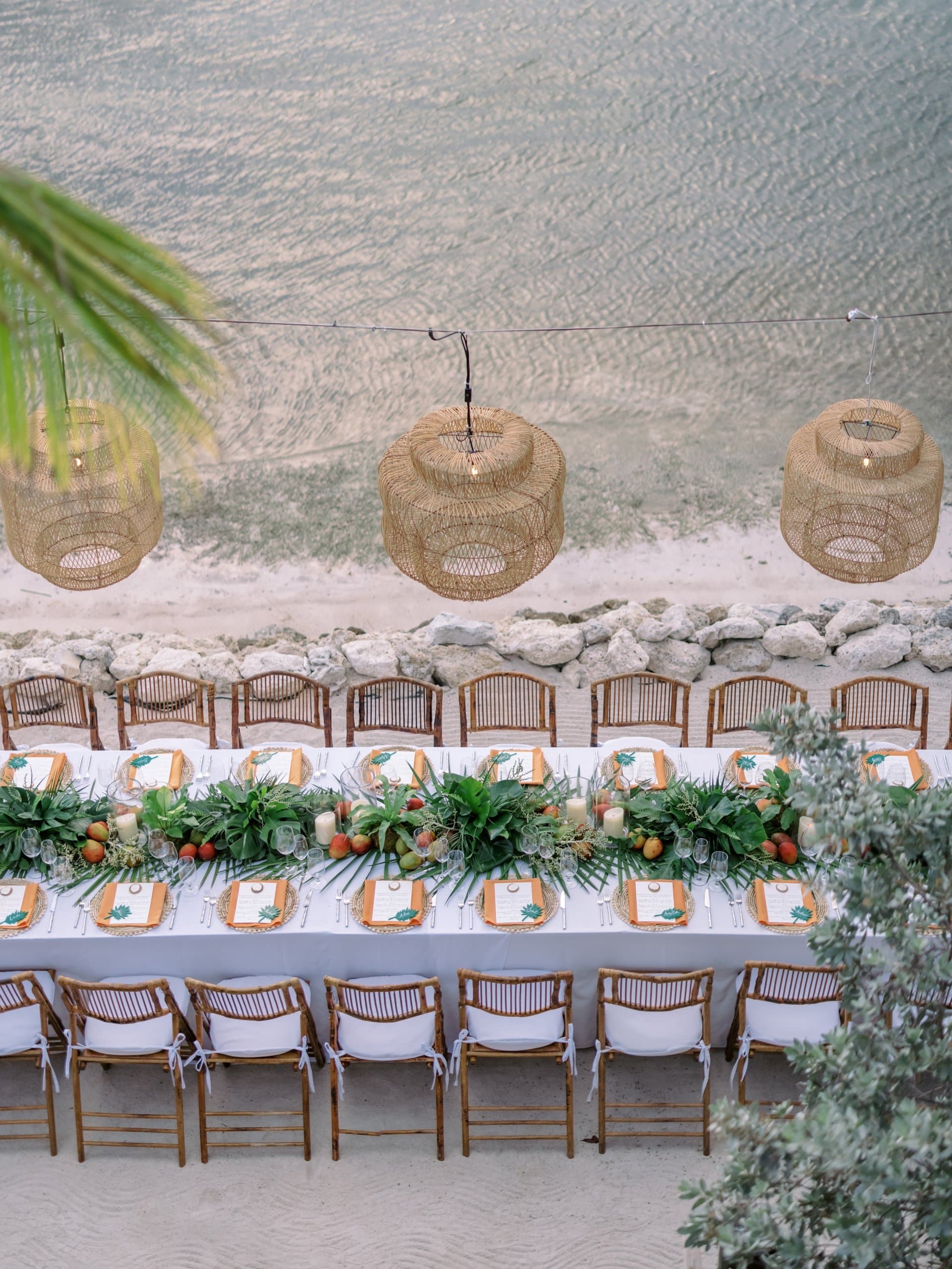 Overhead shot of a row of tables on the beach