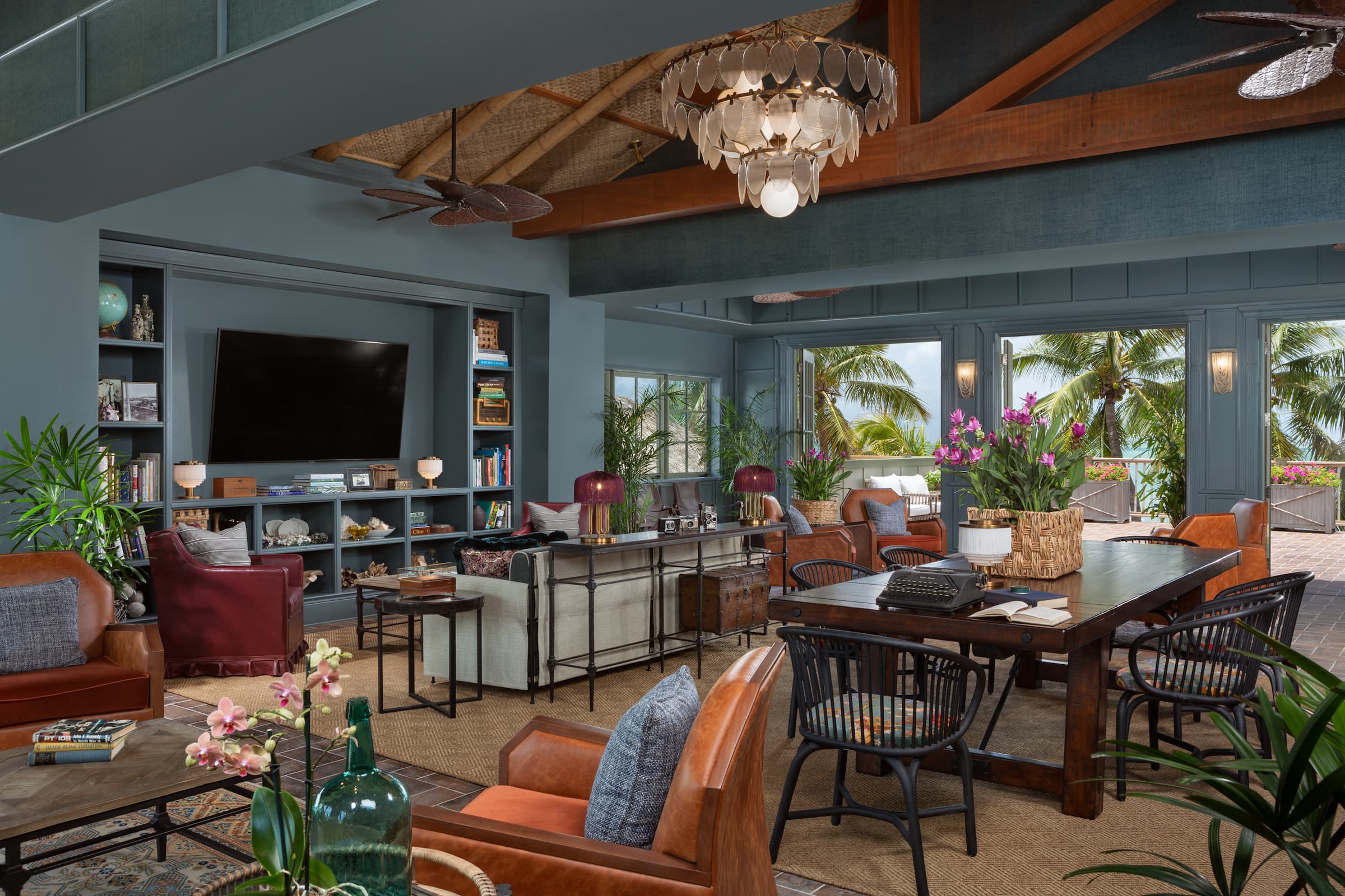 The tv hung up on the wall inside the Great Room of Little Palm Island Resort