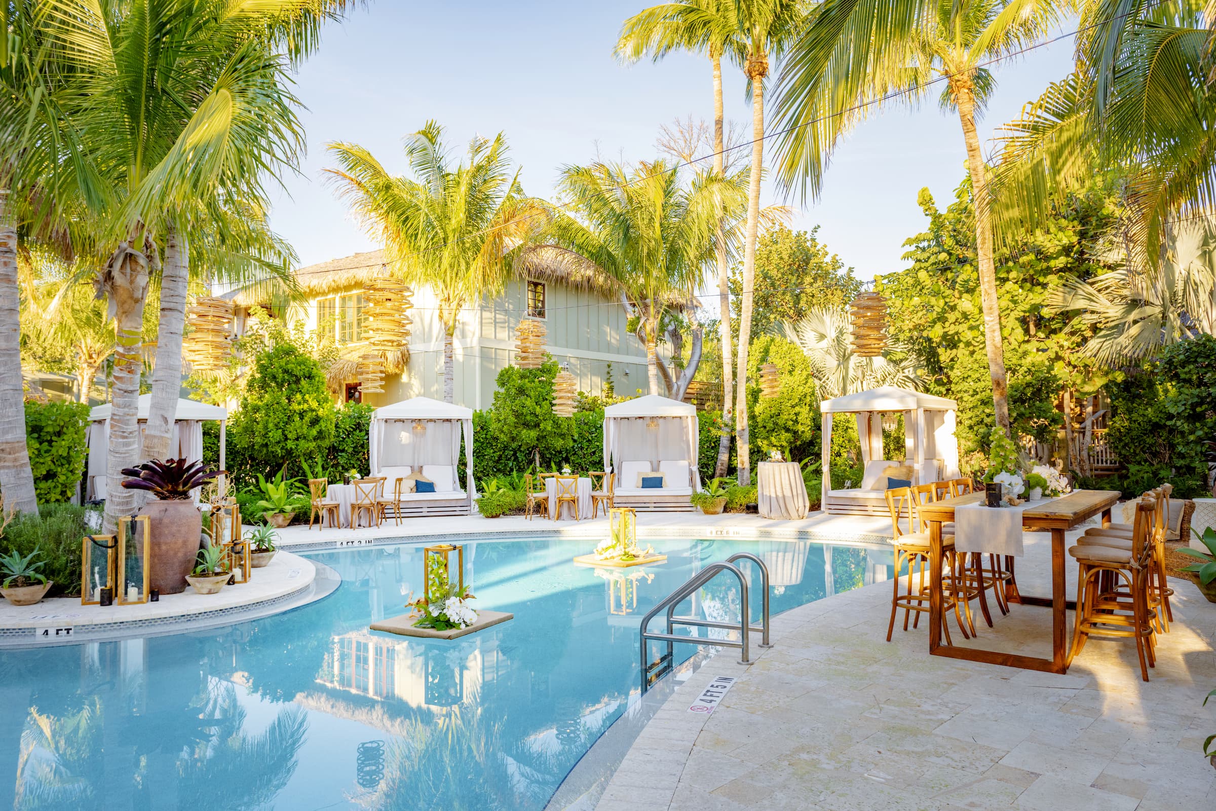 The outdoor pool and cabanas at Little Palm Island Resort