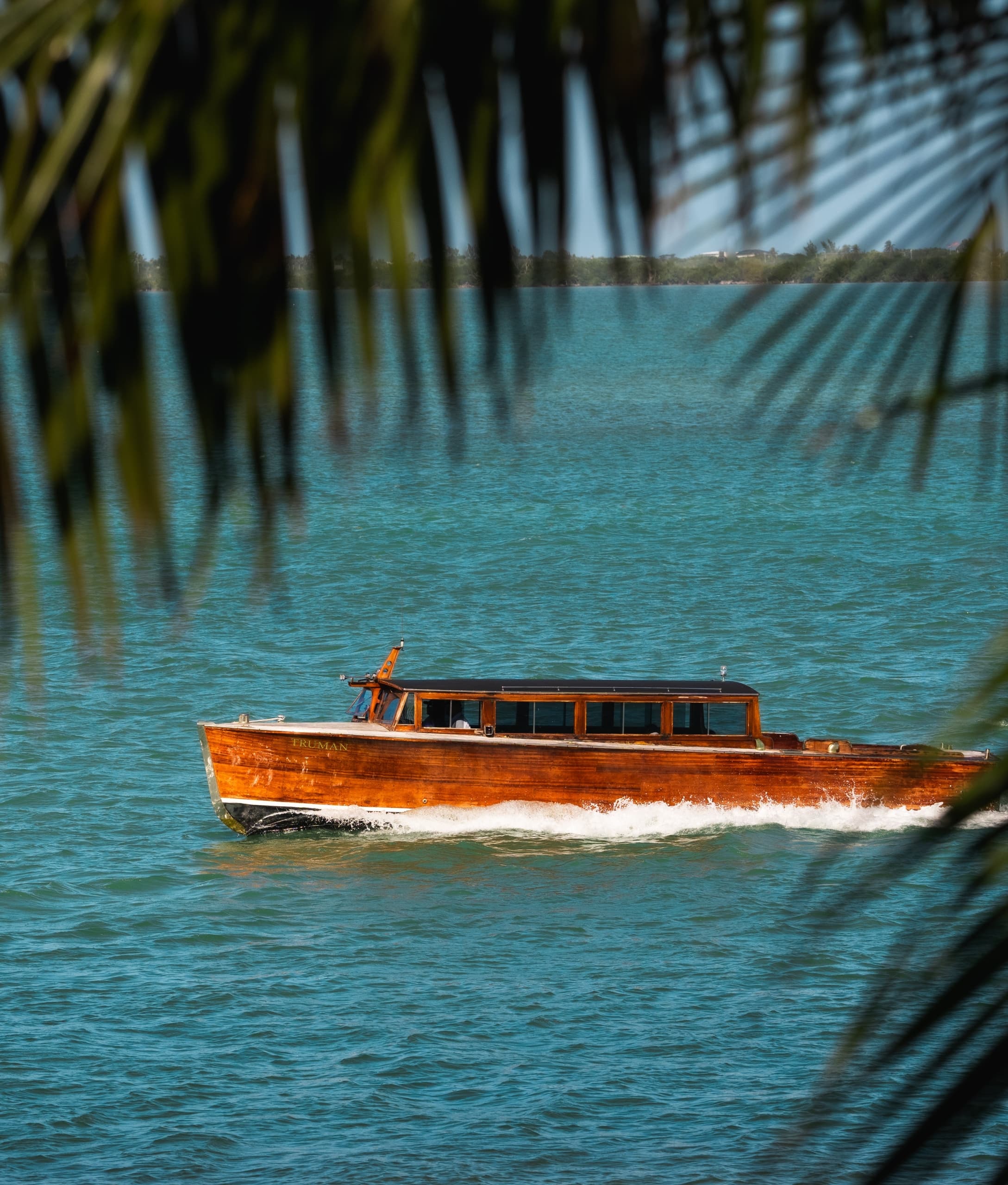 A boat sailing for an off-island activity on Little Palm Island
