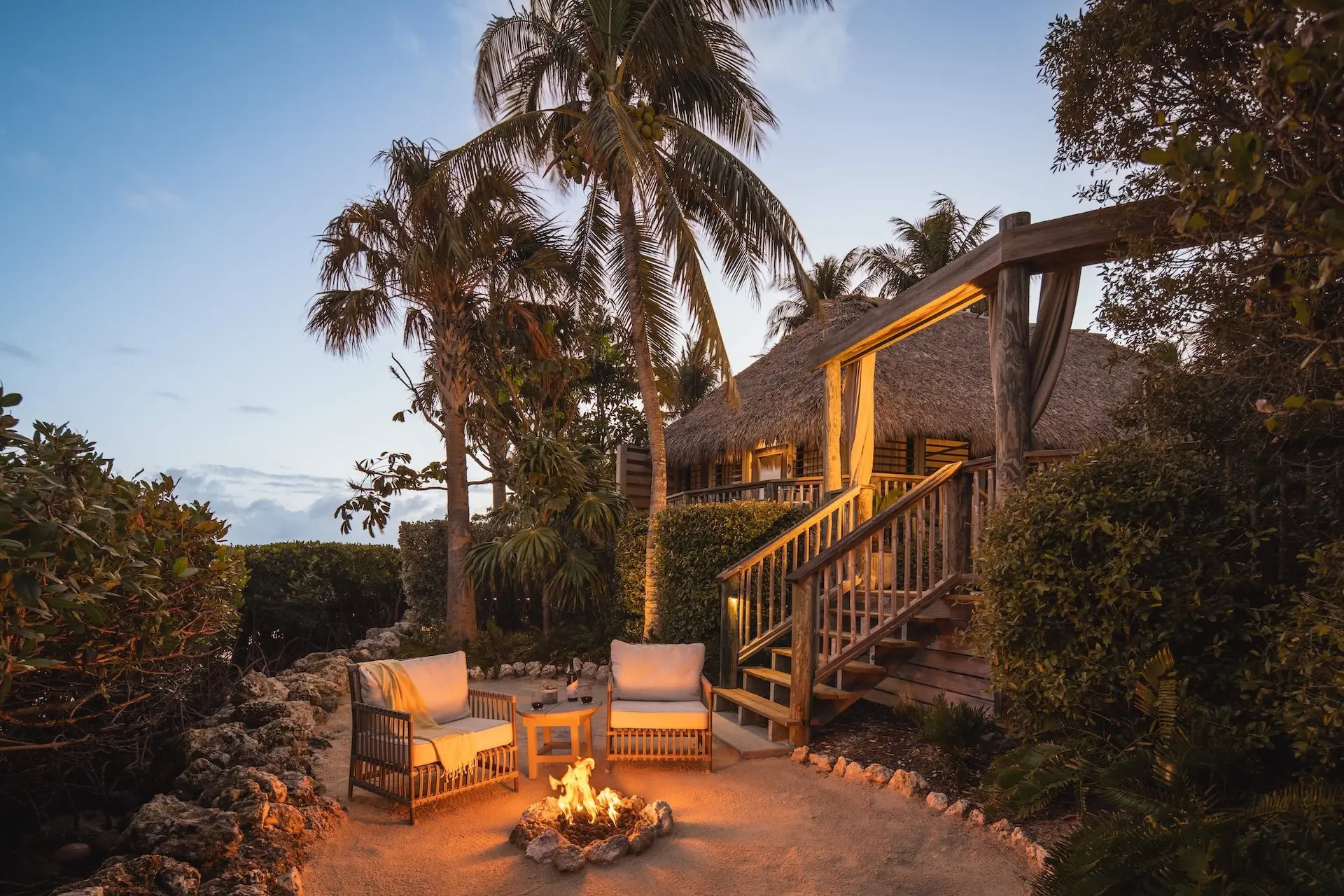 The Romance Suite fire pit and outdoor seating at Little Palm Island Resort.