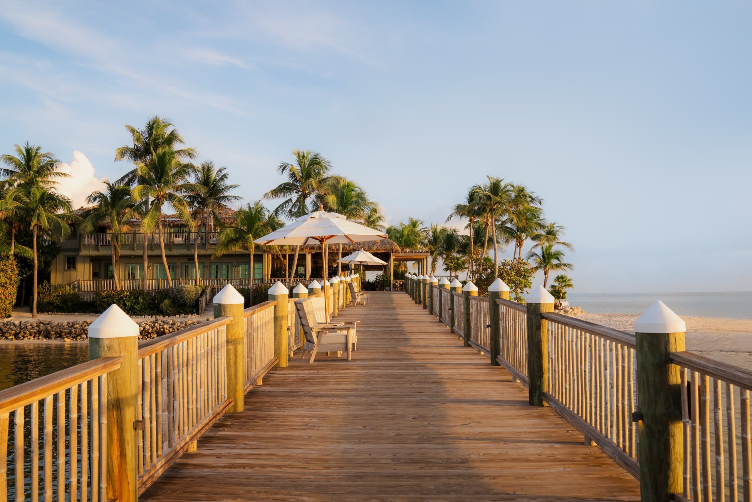 The sunny private boardwalk at Little Palm Island