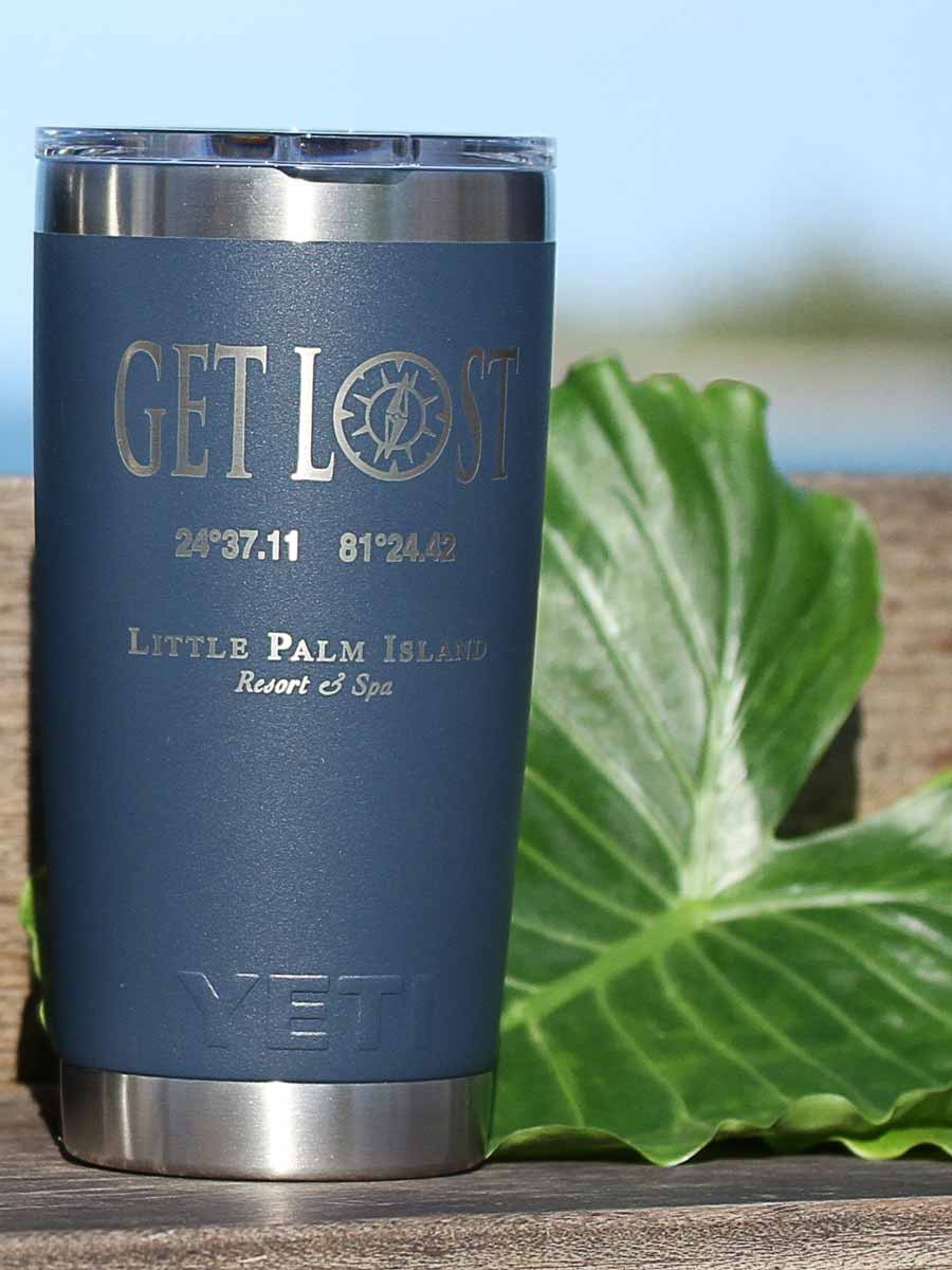 Get Lost Yeti mug on the beach.