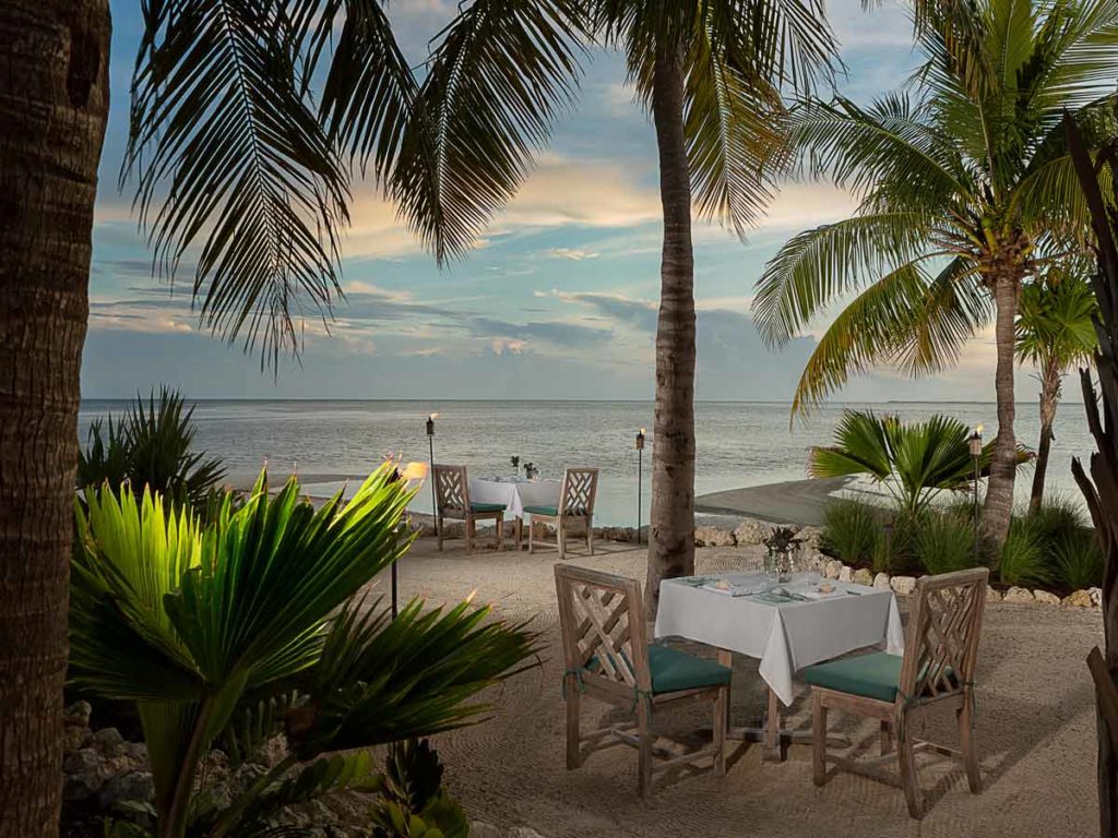 Private outdoor dining by the beach.