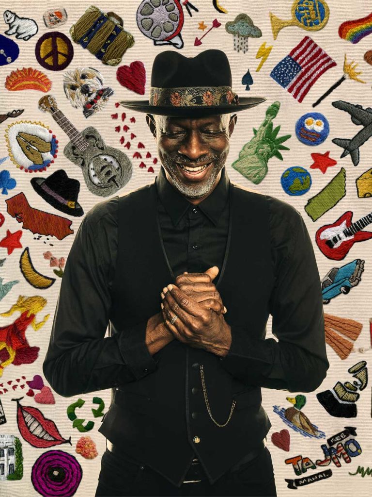 Artist Keb Mo In Front Of A Poster.