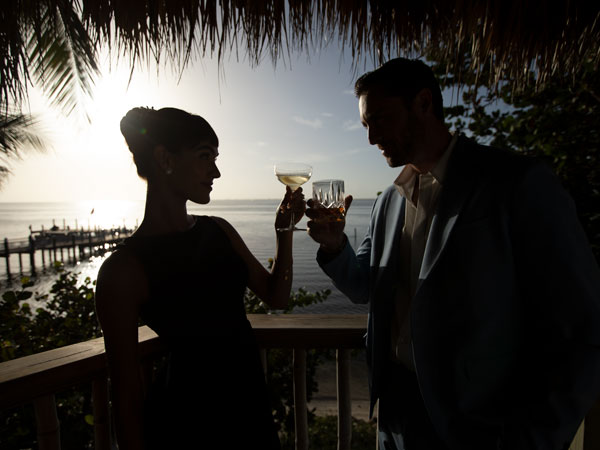 Couple Toasting At Sunset.