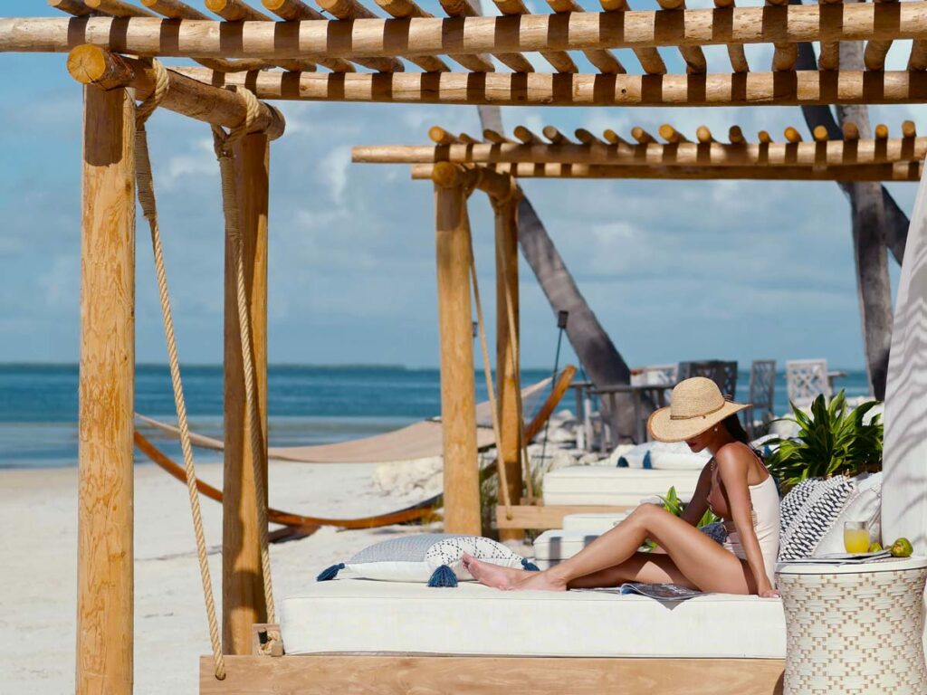 Lady On The Beach In A Cabana