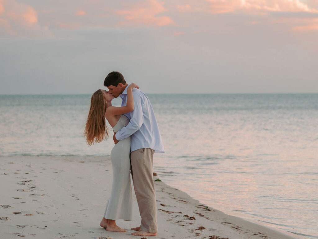 Couple Kissing On The Beach